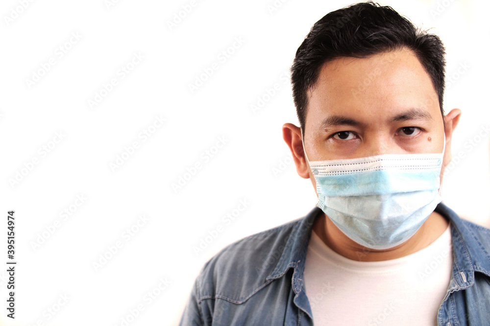 Man wearing protective facial mask. Nwe normal concept. Close up head shot portrait isolated on white Man wearing protective facial mask. Nwe normal concept. Close up head shot portrait isolated on white