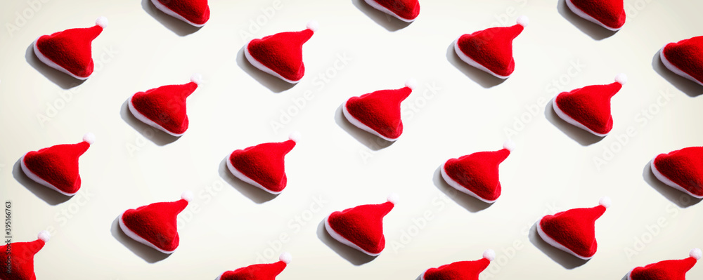 Pattern of small santa hats - overhead view flat lay