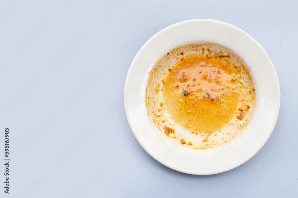 Dirty dish on grey background. Top view Dirty dish on grey background. Top view