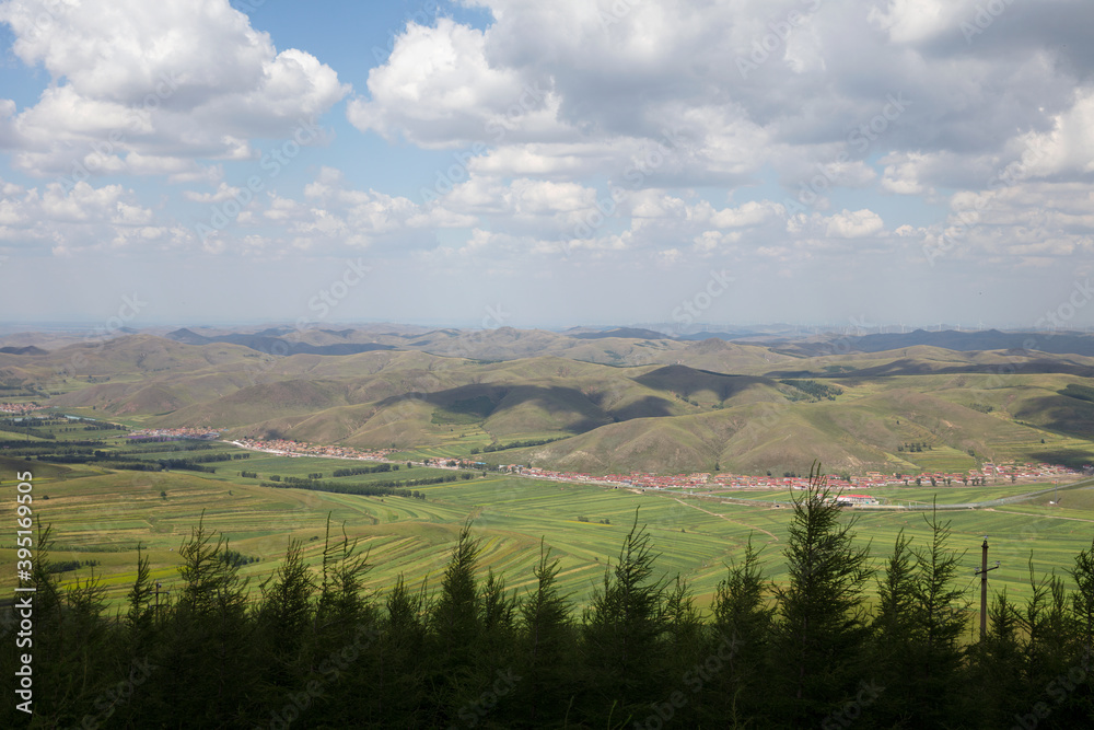 Looking down and shooting the grassland scenery of Zhangbei County under the blue sky and white clouds