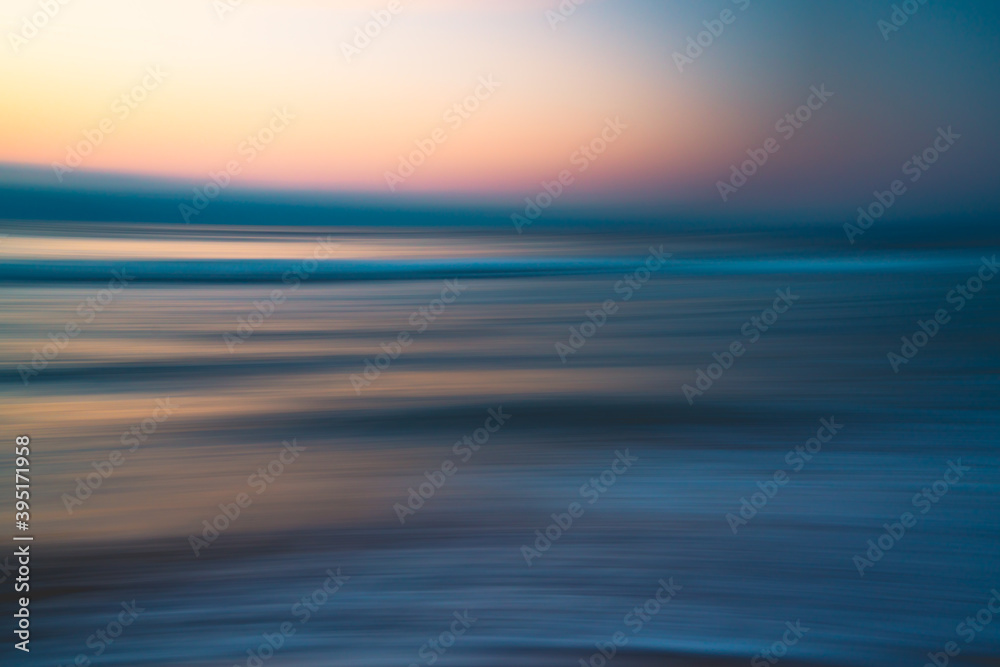 Before sunrise abstract seascape background in soft blur light pink, yellow, blue, and cyan colors