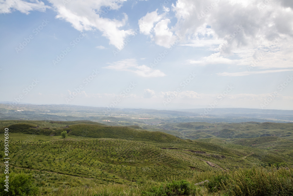 Zhangbei grassland scenery under blue sky and white clouds