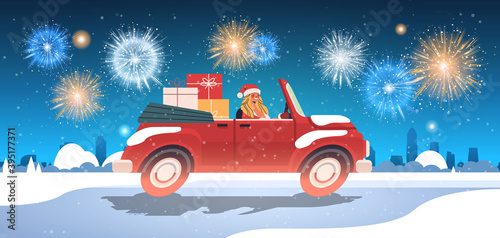 girl in santa claus costume delivering gifts on red car merry christmas happy new year holiday celebration concept fireworks in night sky cityscape background horizontal vector illustration