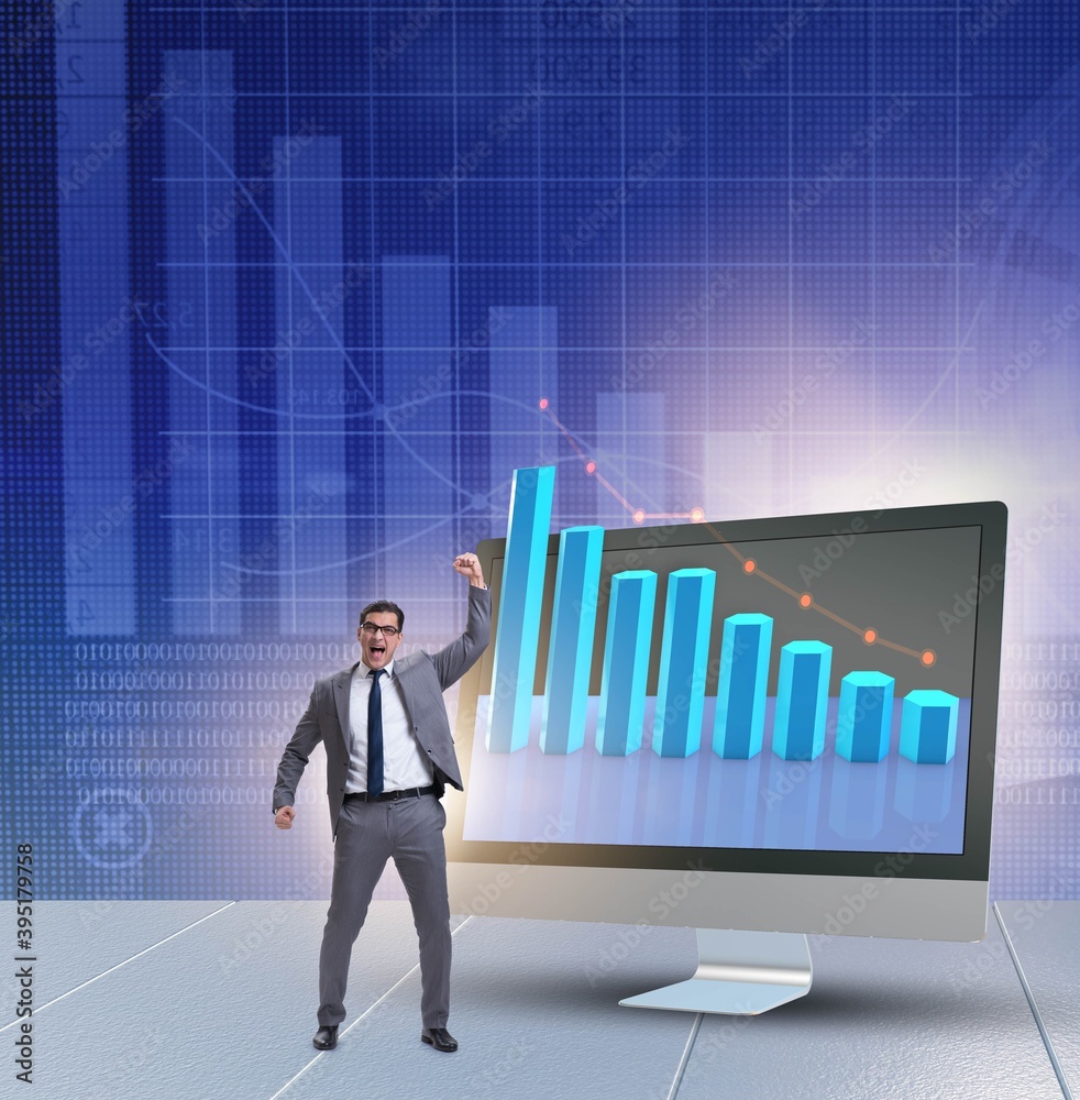 Businessman in economic forecasting concept with charts Businessman in economic forecasting concept with charts