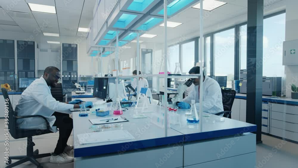 Time-Lapse in Modern Medical Research Laboratory: Team of Scientists Working Using Microscope, Analysing Microbiology Samples. Scientific Lab for Medicine, Biotechnology Development Dolly Shot