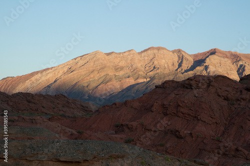Desert landscape. Beautiful view of the red sandstone, canyon, valley and mountains at sunset in Talampaya national park in La Rioja, Argentina.