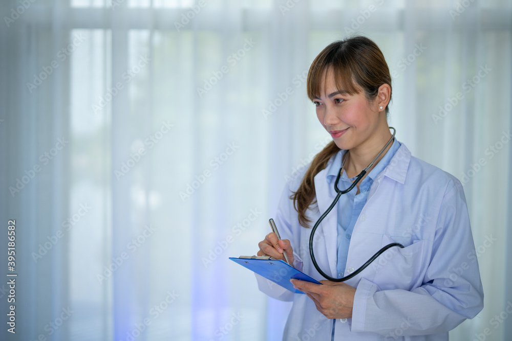 Smiling female doctor in white coat with  Medical stethoscope and Patient prescription . Portrait beautiful young Asian Medical physician doctor.