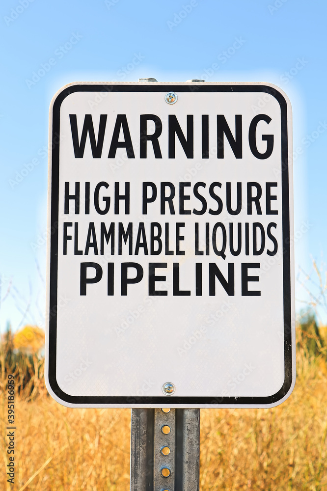 Fototapeta premium A Warning High Pressure Pipeline Flammable Liquids sign