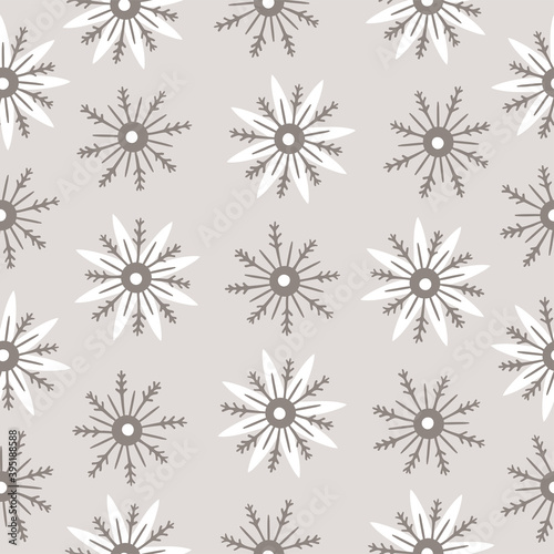 Seamless pattern with hand drawn snowflakes on a beige background. Doodle, simple illustration. It can be used for decoration of textile, paper and other surfaces.