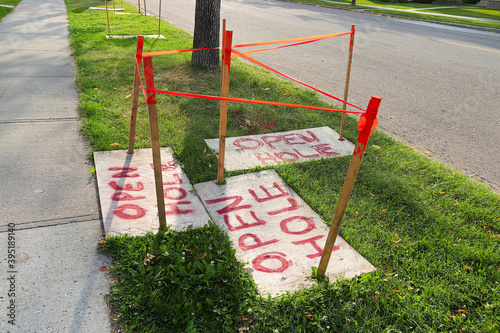 A warning of Opes Hole signs in a cluster photo