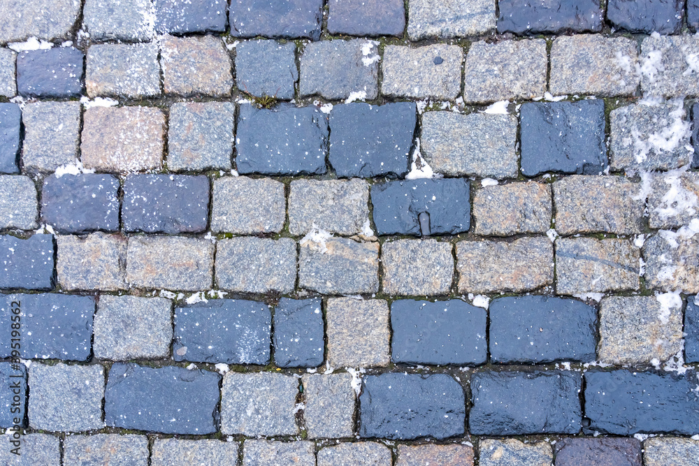 Paving stones on Red Square in Moscow from gabbro-diabases from the islands of Lake Onega in Karelia as a natural background Paving stones on Red Square in Moscow from gabbro-diabases from the islands of Lake Onega in Karelia as a natural background
