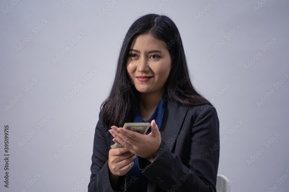 Life style portrait of a young Asian business woman in various poses, studio shot, business concept, isolated background Life style portrait of a young Asian business woman in various poses, studio shot, business concept, isolated background