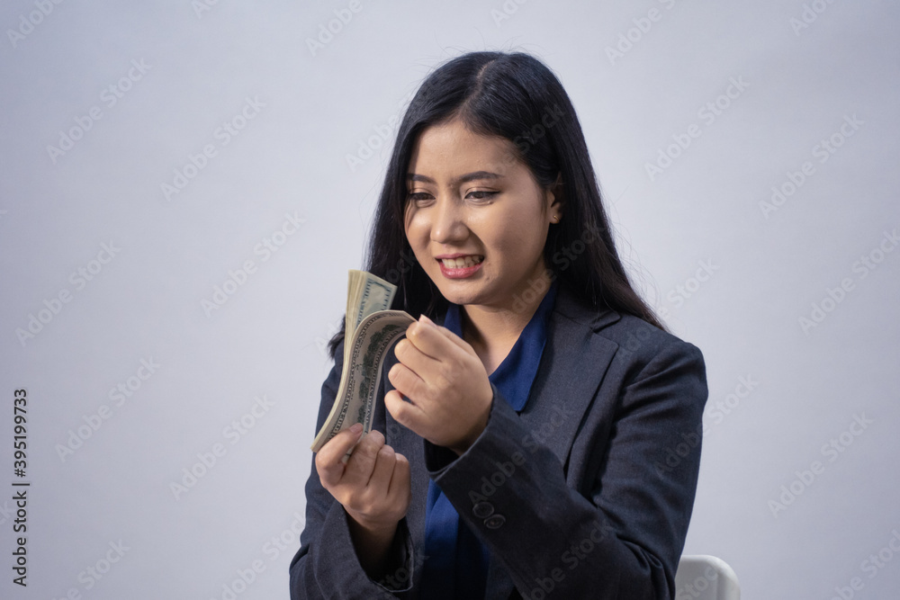 Life style portrait of a young Asian business woman in various poses, studio shot, business concept, isolated background Life style portrait of a young Asian business woman in various poses, studio shot, business concept, isolated background