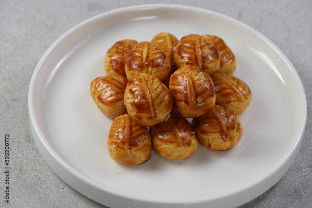 Pinneapple tart, Indonesian name it with Nastar Cookies. Has a small size, and filled with pinneapple jam.
