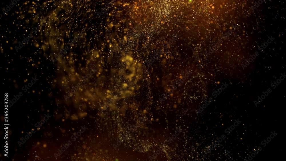 Gold dust particles fly in slow motion in the air lingering slowly. Dust Particles Background Bokeh Lights Background on Black Background 4k Footage Snow Particles Background.