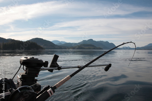 View of Fishing gear on deep sea salmon fishing trip with the ocean and mountain in Vancouver Island, British Columbia, Canada