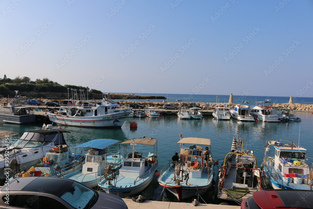 Cyprus. Protaras. Boat mooring. Mediterranean coast. A pier near the church of St. Nicholas. Yachts moored off the coast of Cyprus. Lagoon near the city of Protaras. Tourism to Cyprus. Guide.
