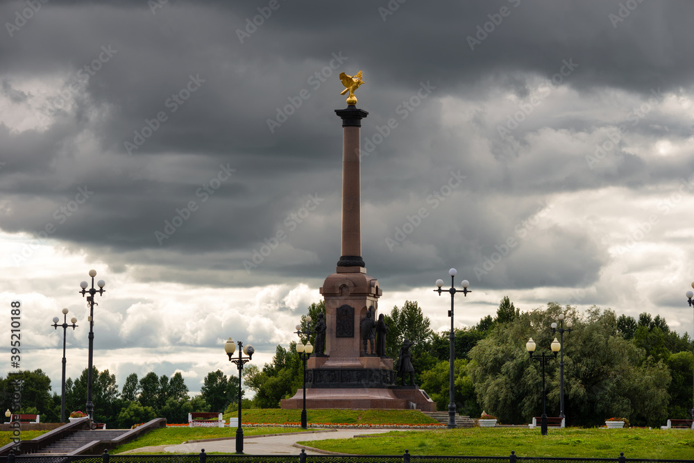 View on a cloudy summer day at the monument to the Millennium of Yaroslavl, located in Strelka Park, at the confluence of the Volga and Kotorosl rivers. Yaroslavl is part of the Golden Ring of Russia.