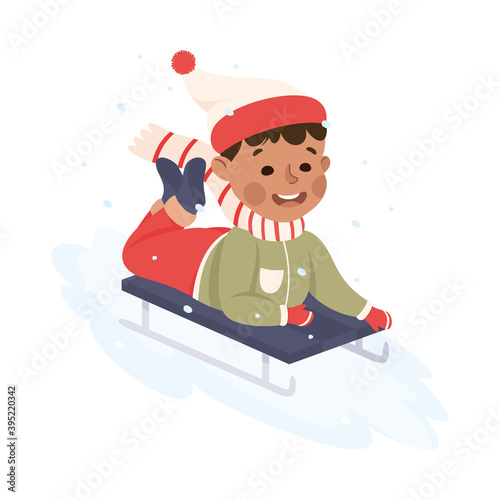 Excited Boy in Warm Clothing Sledging or Sledding Downhill Vector Illustration