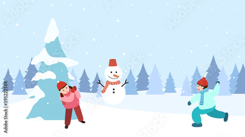 Children playing snowball fight in the snow