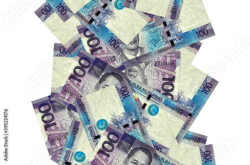 100 Philippine piso bills flying down isolated on white. Many banknotes falling with white copyspace on left and right side