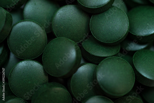 Chlorella or spirulina tablets close up. Nutrition and dietary dupplements. Vegan Protein. © Augustas Cetkauskas