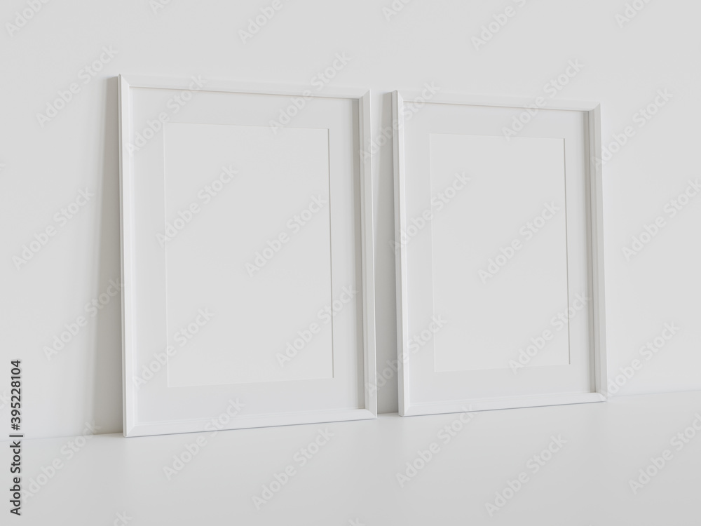 Two white frames leaning on white floor in interior mockup. Template of pictures framed on a wall 3D rendering Two white frames leaning on white floor in interior mockup. Template of pictures framed on a wall 3D rendering