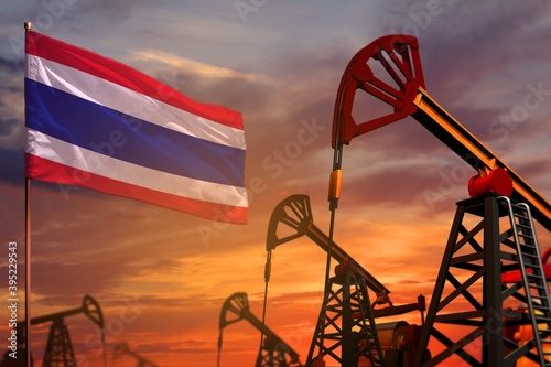 Thailand oil industry concept. Industrial illustration - Thailand flag and oil wells with the red and blue sunset or sunrise sky background - 3D illustration