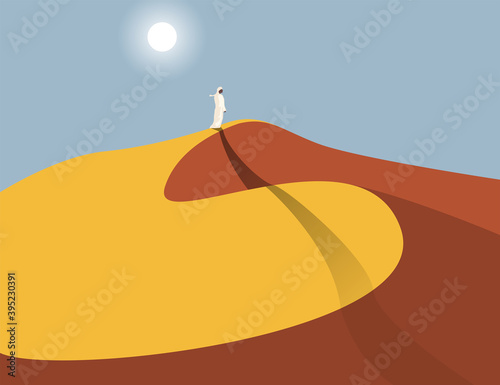 Lonely Arabic man in sand dunes in the Sahara Desert