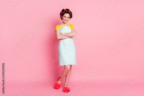 Full length body size view of her she nice-looking attractive pretty cheerful housemaid folded arms posing isolated over pink pastel color background