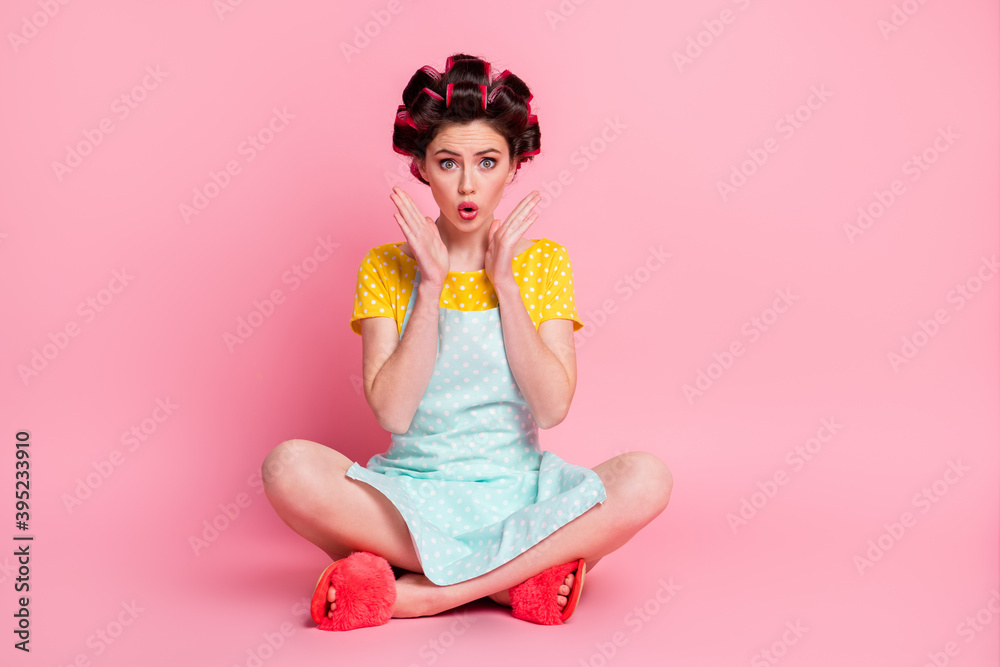 Portrait of glamorous amazed housemaid chef sitting in lotus position pout lips isolated on pink pastel color background Portrait of glamorous amazed housemaid chef sitting in lotus position pout lips isolated on pink pastel color background