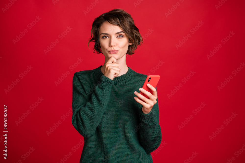 Portrait of charming thinking person hand on chin imagine dream decision isolated on red color background