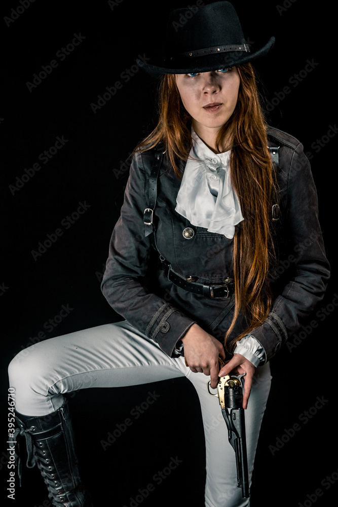 Steampunk. The character is a girl in a hat. Young woman. Studio photography. Portrait. Steampunk. The character is a girl in a hat. Young woman. Studio photography. Portrait.