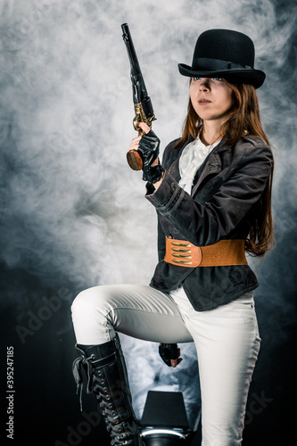Steampunk. The character is a girl in a hat. Young woman. Studio photography. Portrait. © algrigo