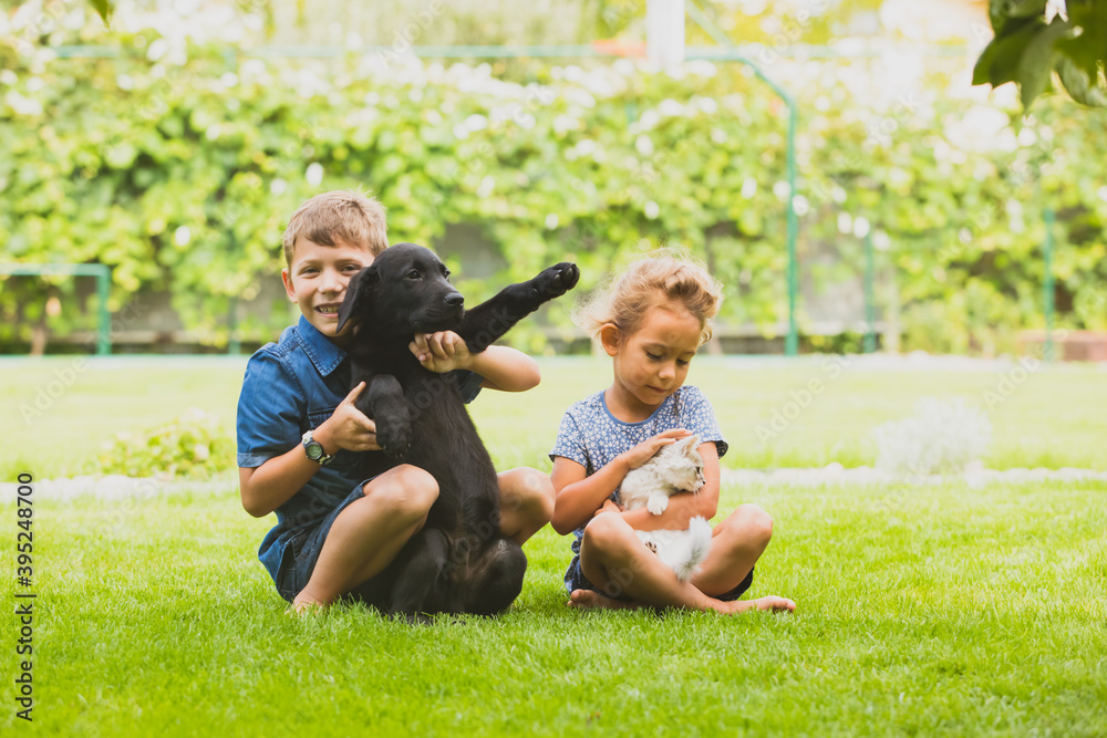 Children learning to be caring and loving pet's owners