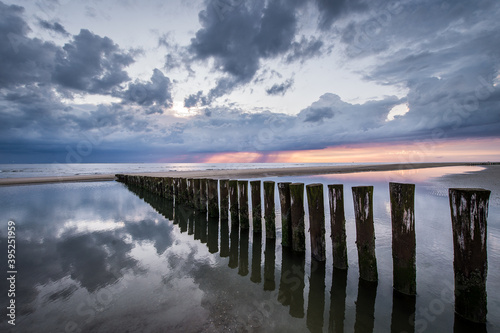 Wallpaper Mural Coast of Ameland, beach poles with person Torontodigital.ca
