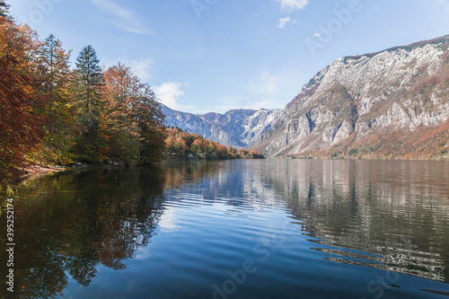 Picturesque lake Bohinj which reflects the Alps. Triglav National Park in Slovenia in autumn
