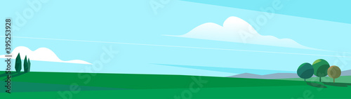 Paesaggio della pianura con degli alberi e cielo azzurro