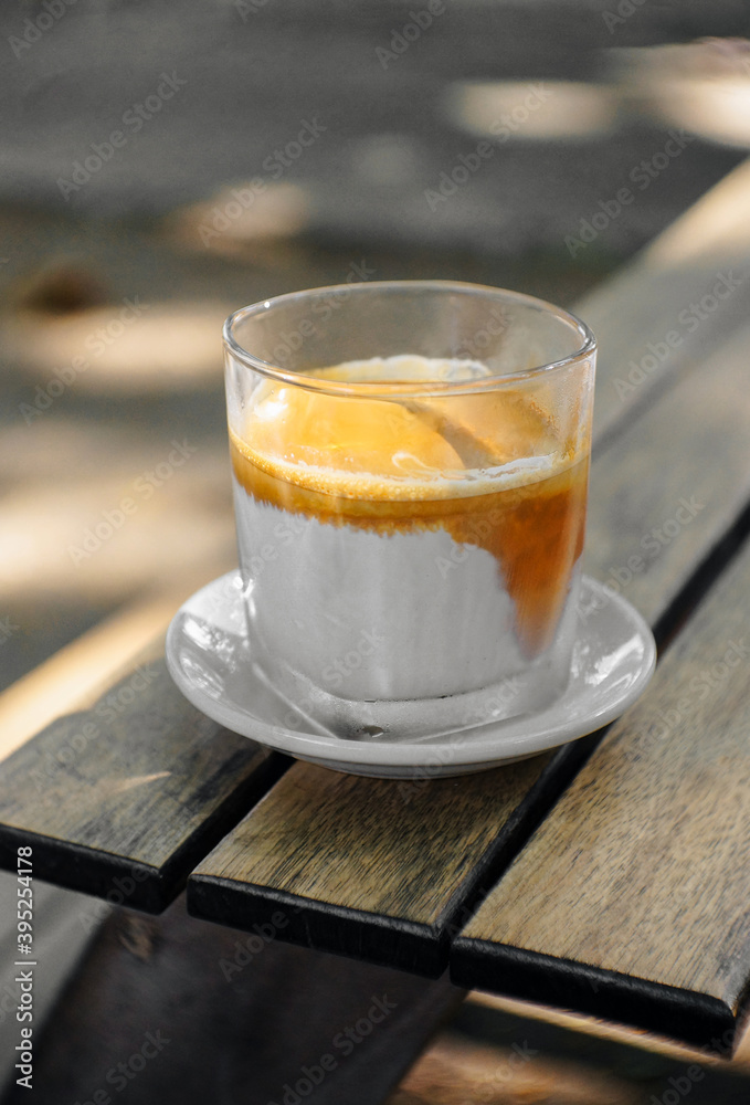 Dirty Coffee latte on a wooden table Dirty Coffee latte on a wooden table