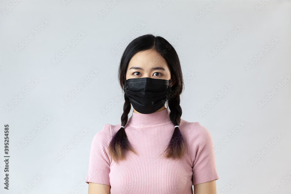 Portrait of asian woman wearing hygienic mask to prevent infection corona virus and Air pollution pm2.5 on white background Portrait of asian woman wearing hygienic mask to prevent infection corona virus and Air pollution pm2.5 on white background