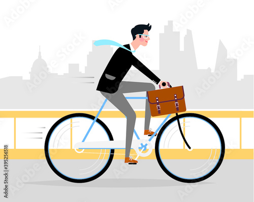 Business style man riding a bicycle at work in the big city.