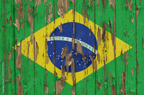 Flag of Brazil on a weathered wooden wall