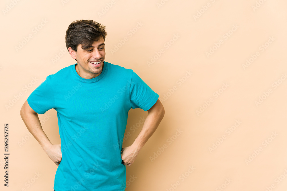 Young cool man laughs and closes eyes, feels relaxed and happy. Young cool man laughs and closes eyes, feels relaxed and happy.