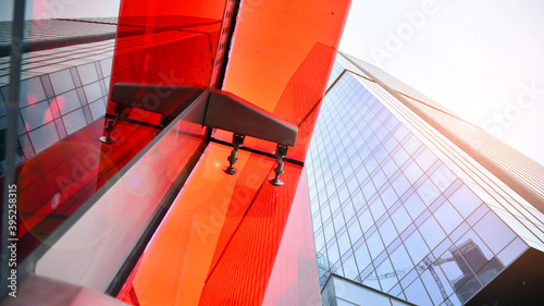 Wallpaper Mural Bottom view of modern office buildings in the business district. Skyscraper glass facades on a bright sunny day with sunbeams in the blue sky. Torontodigital.ca