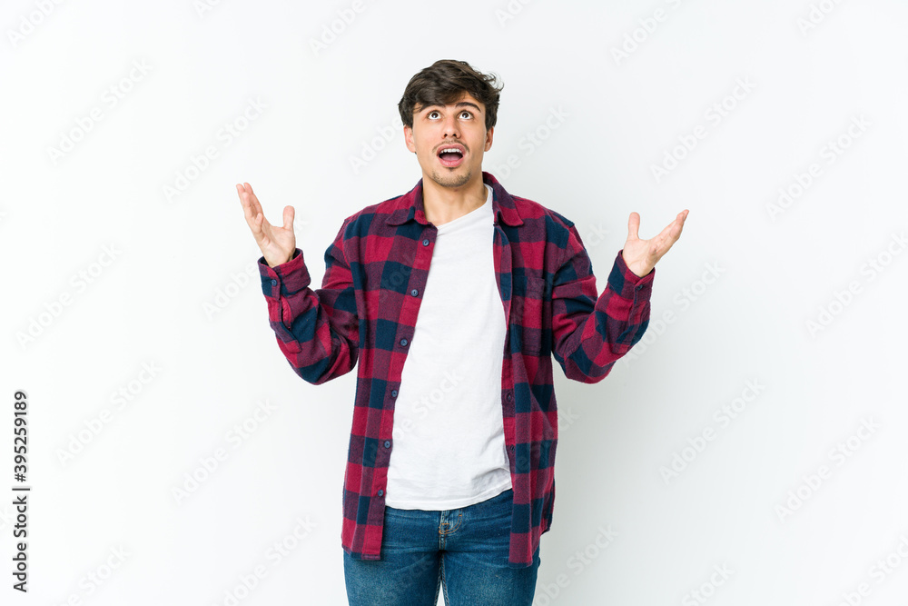 Fototapeta premium Young cool man screaming to the sky, looking up, frustrated.