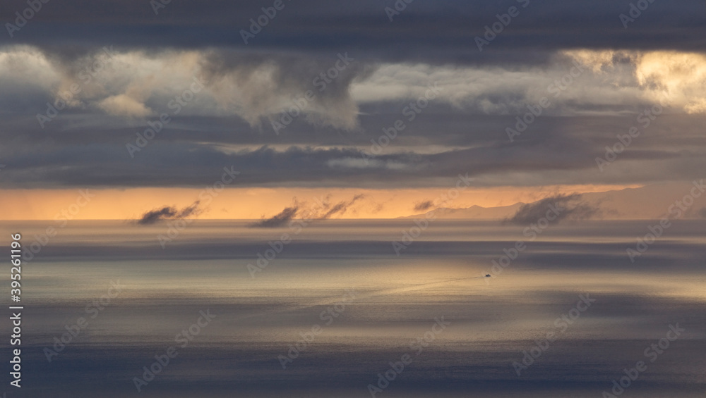 The ferry to La Gomera, moody evening light, taken from high on Mount Teide, Tenerife, Canary Islands, Spain.