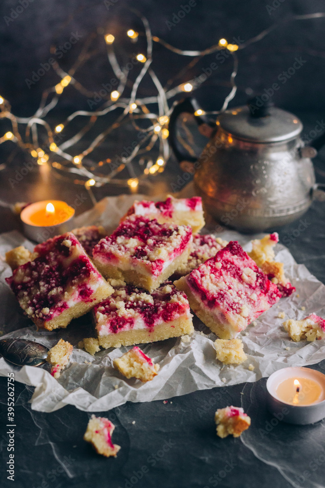 Delicious pie with raspberries and curd cheese. Pieces of pie on the table