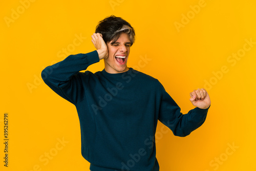 Young skinny hispanic man dancing and having fun.