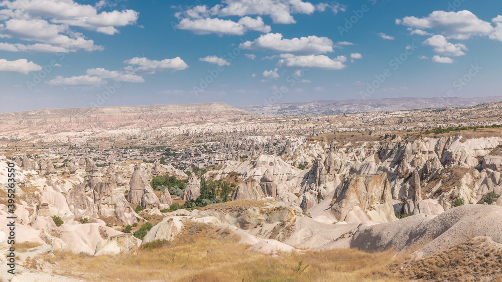 Fototapeta premium Red Valley and Rose Valley of Goreme of Nevsehir in Cappadocia aerial timelapse, Turkey.