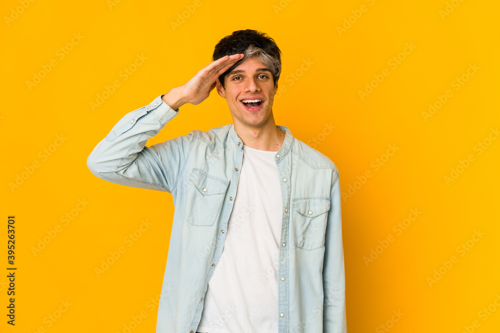 Young skinny hispanic man shouts loud, keeps eyes opened and hands tense. Young skinny hispanic man shouts loud, keeps eyes opened and hands tense.